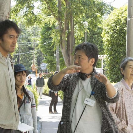 Hirokazu Koreeda (centre) directs Hiroshi Abe (left) and Kirin Kiki on the set of After the Storm.