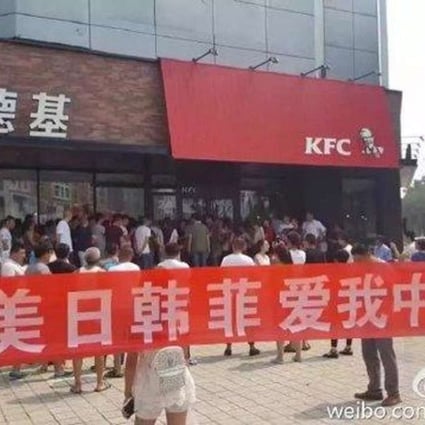 Dozens of protesters gathered outside a KFC outlet in Laoting county in Hebei province on Sunday. Photo: SCMP Pictures