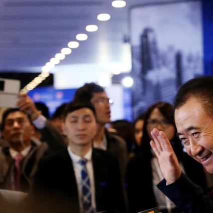 Wang Jianlin, chairman of Dalian Wanda Group, speaks to the media after attending the Asian Financial Forum in Hong Kong in January. His company has made it into the Fortune 500 for the first time. Photo: Nor Tam, SCMP