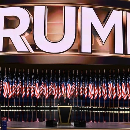 Trump took to the stage against a backdrop of American flags, and the name that is synonymous with his brand of business and, now, politics. Photo: Bloomberg