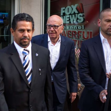 Rupert Murdoch (centre) and son Lachlan Murdoch (left) leave the News Corporation building on Thursday in New Yorkafter Fox News CEO Roger Ailes departed the company. Photo: AFP