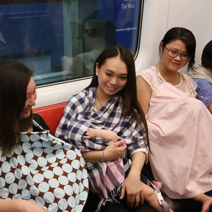Mothers breastfeeding their babies during a flashmob event for the cause at Tai Wai MTR station. Photo: Sam Tsang