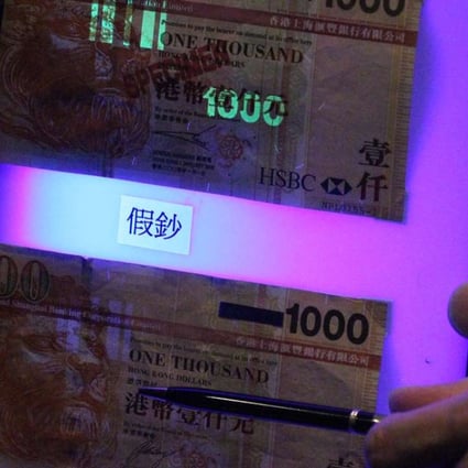 A real (above) and a fake HK$1,000 banknote. Photo: Felix Wong