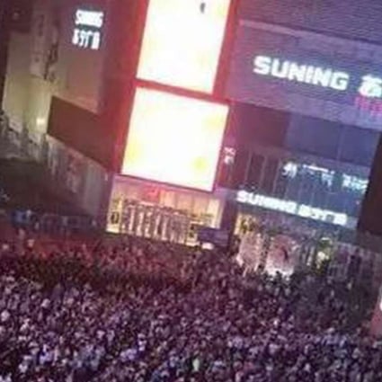Crowds fill a square in downtown Lianyungang in Jiangsu province on Saturday, despite warnings from police that the protest organisers had not received permission for the gathering. Photo: SCMP Pictures