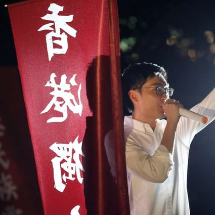 Hong Kong National Party convenor Chan Ho-tin speaks during a rally to protest against the disqualification of his application to run in the Legislative Council election. Photo: Reuters