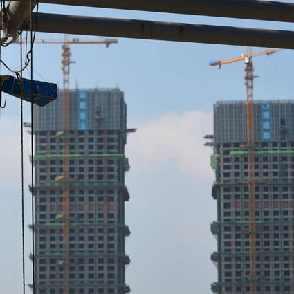 A housing construction site in Hefei, Anhui province. Inventories there are down to 2.3 months. Photo: Reuters