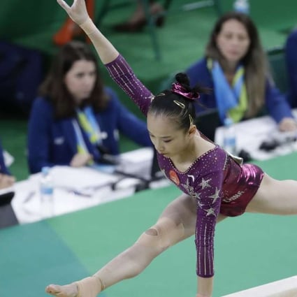 China's Fan Yilin performs on the balance beam during the artistic gymnastics women's team final in Rio. The judging has been blamed for her failure to reach the individual event finals.