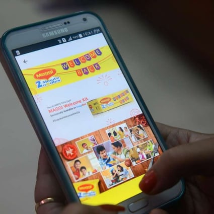 A woman registers on the e-commerce website Snapdeal for the Maggi Noodles 'Welcome Kit', in Siliguri. Snapdeal.com says it has raised US$500 million from investors including Alibaba and Foxconn. Photo: AFP