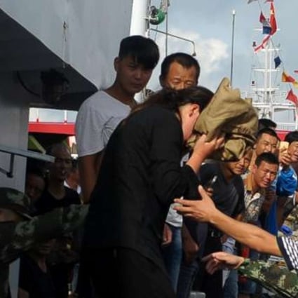 The woman is returned to shore after her ordeal at sea. Photo: SCMP Pictures