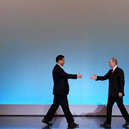 President Xi Jinping (left) is welcomed by Russian counterpart Vladimir Putin at the opening ceremony of "The Year of Chinese Tourism in Russia" in Moscow in March 2013. Photo: AFP