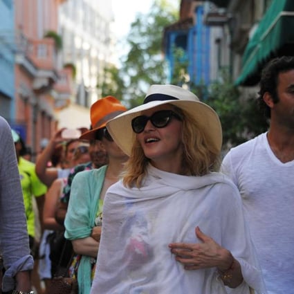 Madonna walks along a street in Havana, where she is celebrating her 58th birthday. Photo: AFP
