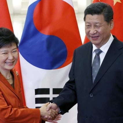 President Xi Jinping shakes hands with South Korean President Park Geun-hye during a meeting at the Great Hall of the People in Beijing on the sidelines of the 2014 Apec summit. Photo: EPA