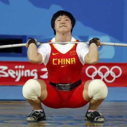 Liu Chunhong of China lifts 158kg to set a world record in the women’s 69kg clean & jerk at the Beijing 2008 Olympic Games. Photo: Reuters