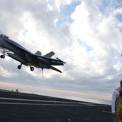An F/A-18 Super Hornet prepares to land on the deck of the USS Eisenhower off the coast of Virginia in December, 2015 in the Atlantic Ocean. US Defence Secretary Ash Carter visited the carrier with India's Minister of Defence Manohar Parrikar to demonstrate US Navy aircraft carrier flight operations. Photo: AFP