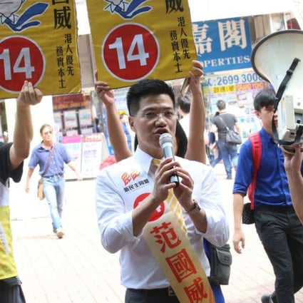 Fan (centre) outside Tai Wai station on Sunday. Photo: David Wong