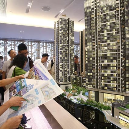 Potential buyers attend sales office of the One Kai Tak development at Exchange Tower in Kowloon Bay. Photo: Dickson Lee