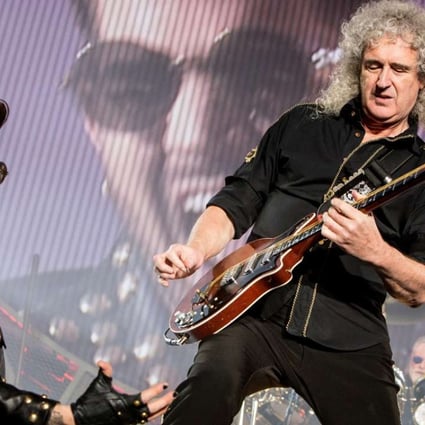 Brian May (right) and Adam Lambert perform in Italy earlier this year.