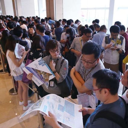 Potential buyers queuing at the sales office of China Overseas Land's One Kai Tak development in Kowloon Bay on September 3. Photo: Felix Wong