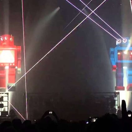Giant robots on stage at a Chemical Brothers show.