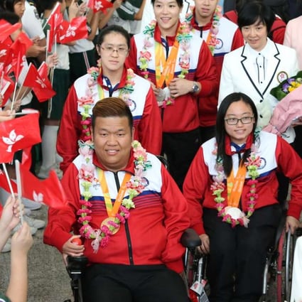 Rio Paralympic Games gold medallist Leung Yuk-wing leads the Hong Kong squad as they are welcomed back on their return. Photos: K. Y. Cheng