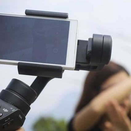 DJI’s Osmo Mobile, which enables smartphone users to shoot more professional-looking videos. Photo: May Tse