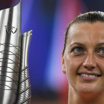 Petra Kvitova holds the trophy after winning the Wuhan Open. Photo: AFP