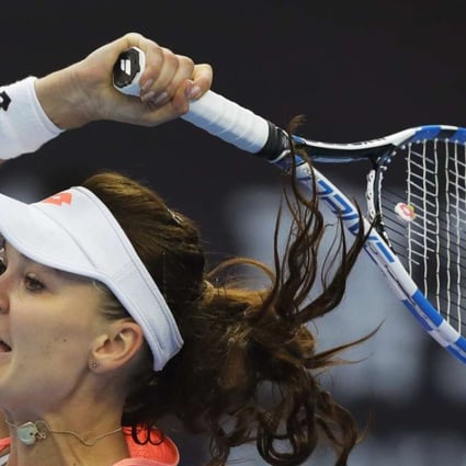 Agnieszka Radwanska of Poland hits a return shot against Wang Qiang of China at the China Open. Photo: AP