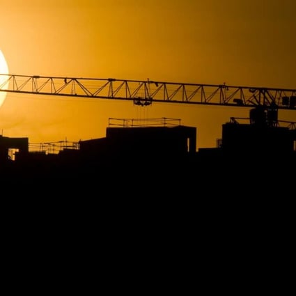 The sun sets over a construction site in Singapore's Punggol area. Photo: Xinhua
