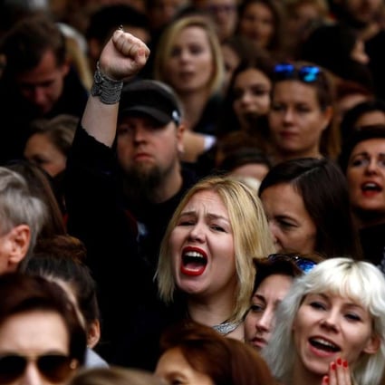 A woman shouts slogans as she takes part in an abortion rights campaigners' demonstration in front of the Parliament in Warsaw. Photo: Reuters