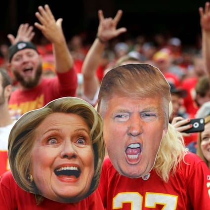 KANSAS CITY, MO - SEPTEMBER 25: Kansas City Chiefs fans wear Hillary Clinton and Donald Trump masks during the game bethween the Chiefs and the New York Jets at Arrowhead Stadium on September 25, 2016 in Kansas City, Missouri. Jamie Squire/Getty Images/AFP == FOR NEWSPAPERS, INTERNET, TELCOS & TELEVISION USE ONLY ==