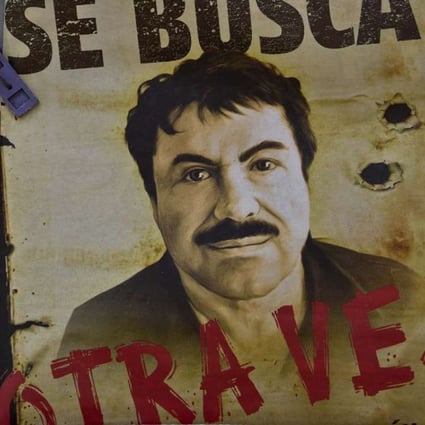 A poster with the face of Mexican drug lord Joaquin "El Chapo" Guzman, reading "Wanted, Again", is displayed at a news-stand in one Mexico City's major bus terminals in 2015. Photo: AFP