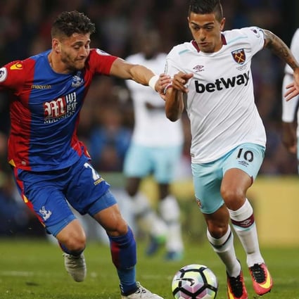 West Ham United's Manuel Lanzini in action with Crystal Palace's Joel Ward. Photos: Reuters