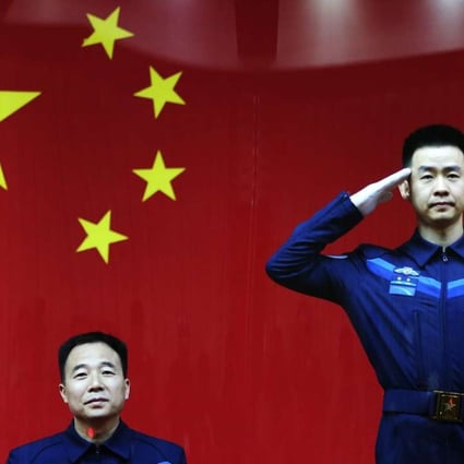 Shenzhou XI mission commander Jin Haipeng (left) is a major general in the People’s Liberation Army, while crew member Chen Dong is a colonel. Photo: EPA