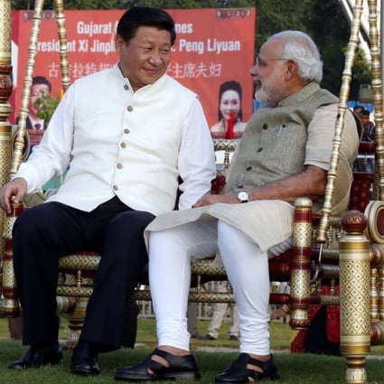 Chinese President Xi Jinping sits on a swing with Indian Prime Minister Narendra Modi at a riverside park in Gujarat in 2014. Photo: Xinhua