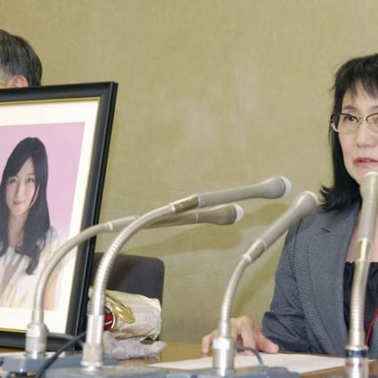 Yukimi Takahashi, the mother of Matsuri Takahashi, a 24-year-old Dentsu employee who committed suicide in 2015, with her lawyer Hiroshi Kawahito in Tokyo, after her daughter’s death was deemed to have been caused by overwork. Photo: Kyodo