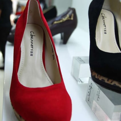 C.banner shoes on display in a shop in Beijing. The company recorded its first buy-back since July last year with 2.16 million shares purchased on October 20 at HK$2.12 each. Photo: Simon Song