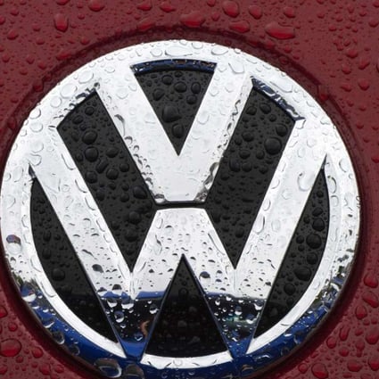 The VW emblem is seen on a Volkswagen for sale at a dealership in Gaithersburg, Maryland. A US judge on October 25, 2016 granted final approval for a $14.7 billion class action settlement in Volkswagen's diesel emissions cheating scandal. Photo: AFP