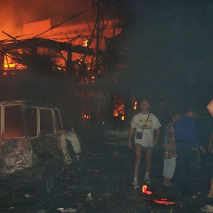 Residents and foreign tourists are evacuated after the 2002 Bali bombings. Photo: AP