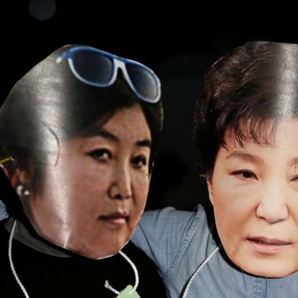 Protesters wearing masks of South Korean President Park Geun-hye (right) and Choi Soon-sil at a protest denouncing the president over an influence-peddling scandal. Photo: Reuters