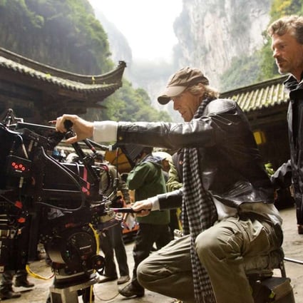Director Michael Bay lines up a shot for camera operator John Skotchdopole in Wulong Karst National Park in China during filming of Transformers: Age of Extinction. Photo: Paramount Pictures