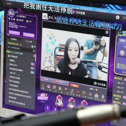 A computer screen shows Xiao Mi, an internet broadcast host, performing in her studio during a live web stream from Zhengzhou. Photo: Imaginechina