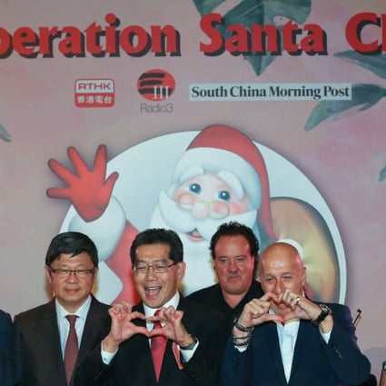 (From left) Leung Ka-wing, RTHK Director of Broadcasting; Robin Hu, CEO of SCMP; Gregory So Kam-leung, Secretary for Commerce and Economic Development and Allan Zeman attend the launch of Operation Santa Claus in Lan Kwai Fong. Photo: Nora Tam