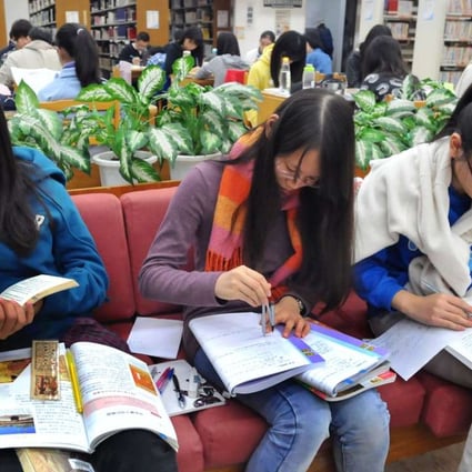 College students at the Taipei public library. Photo: AFP