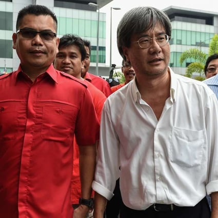 Malaysiakini's editor-in-chief Steven Gan, second from right, has been charged over a video featuring a prominent dissident. Photo: AFP