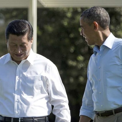 Chinese President Xi Jinping, left, walks with President Barack Obama at Sunnylands estate in California in June 2013. Photo: AP