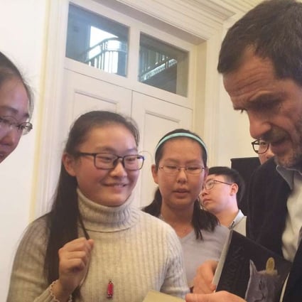 British Harry Potter producer David Heyman gives fans autographs at the British embassy in Beijing, where he and Alibaba Pictures announced they would make a fantasy movie, Warriors. Photo: AP