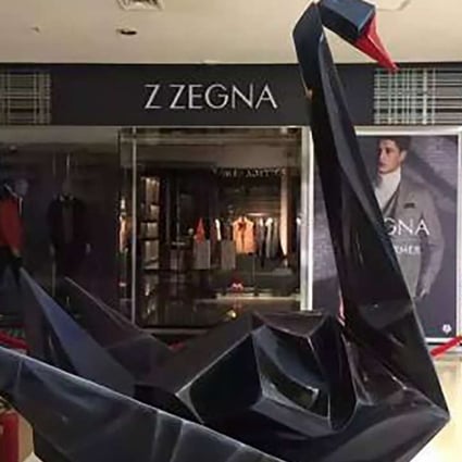The black swan sculpture on display at the entrance to a Beijing shopping mall on Monday morning shortly before it was removed. Photo: SCMP Pictures