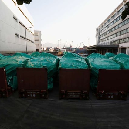 Armoured troop carriers, belonging to Singapore, are detained at a cargo terminal in Hong Kong. Photo: Reuters