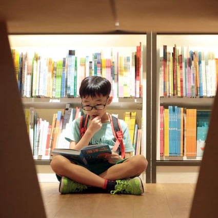 An engrossed young reader at the Eslite Spectrum bookstore at Star House in Tsim Sha Tsui on October 2 last year. Visitors can also buy refreshments, jewellery, arts and crafts, handbags, skincare and organic products. Photo: Bruce Yan