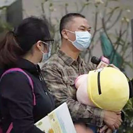 The child’s father Luo Er interviewed by the media. Photo: SCMP Pictures